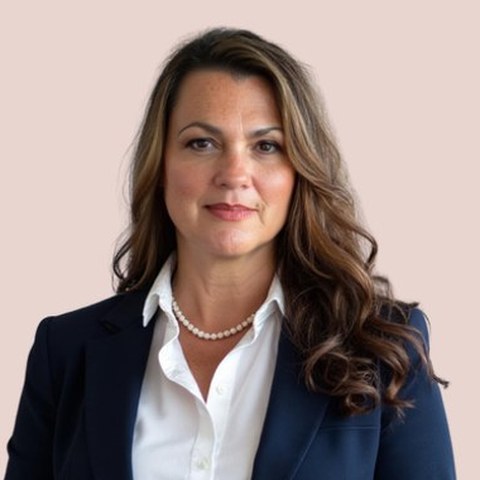Crystal Reardon Miller in a navy suit